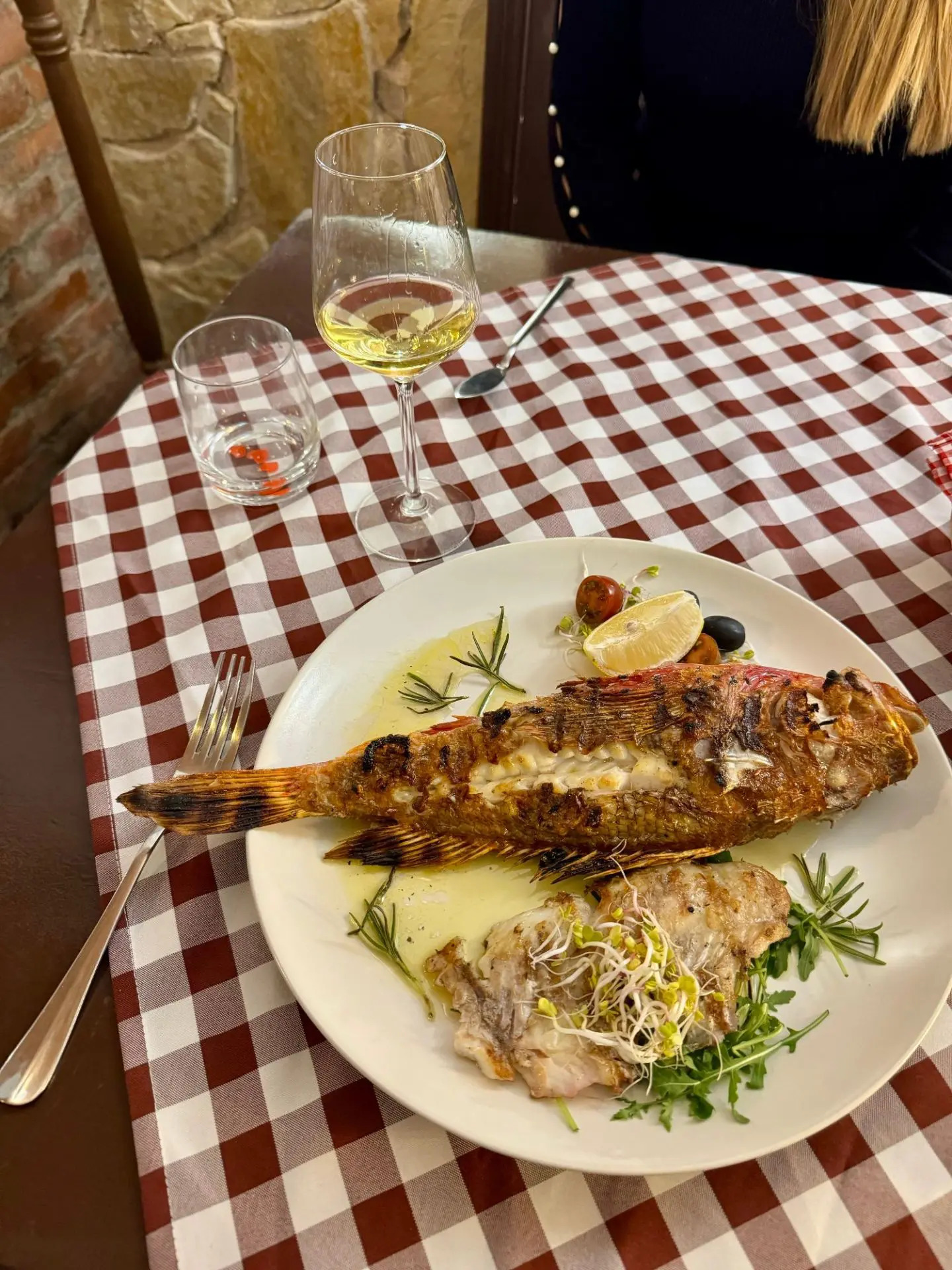 A beautifully plated sea bass dish at Konoba