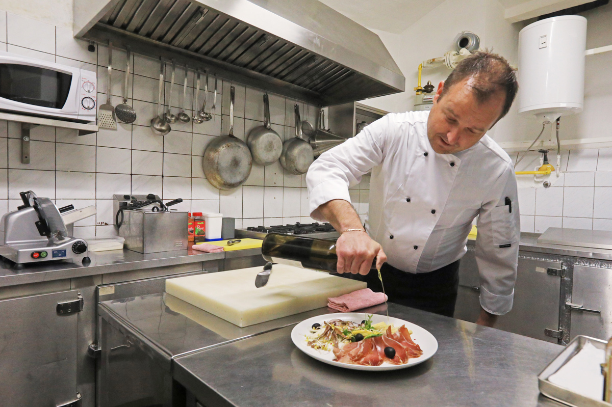 A glass of red wine on a rustic table